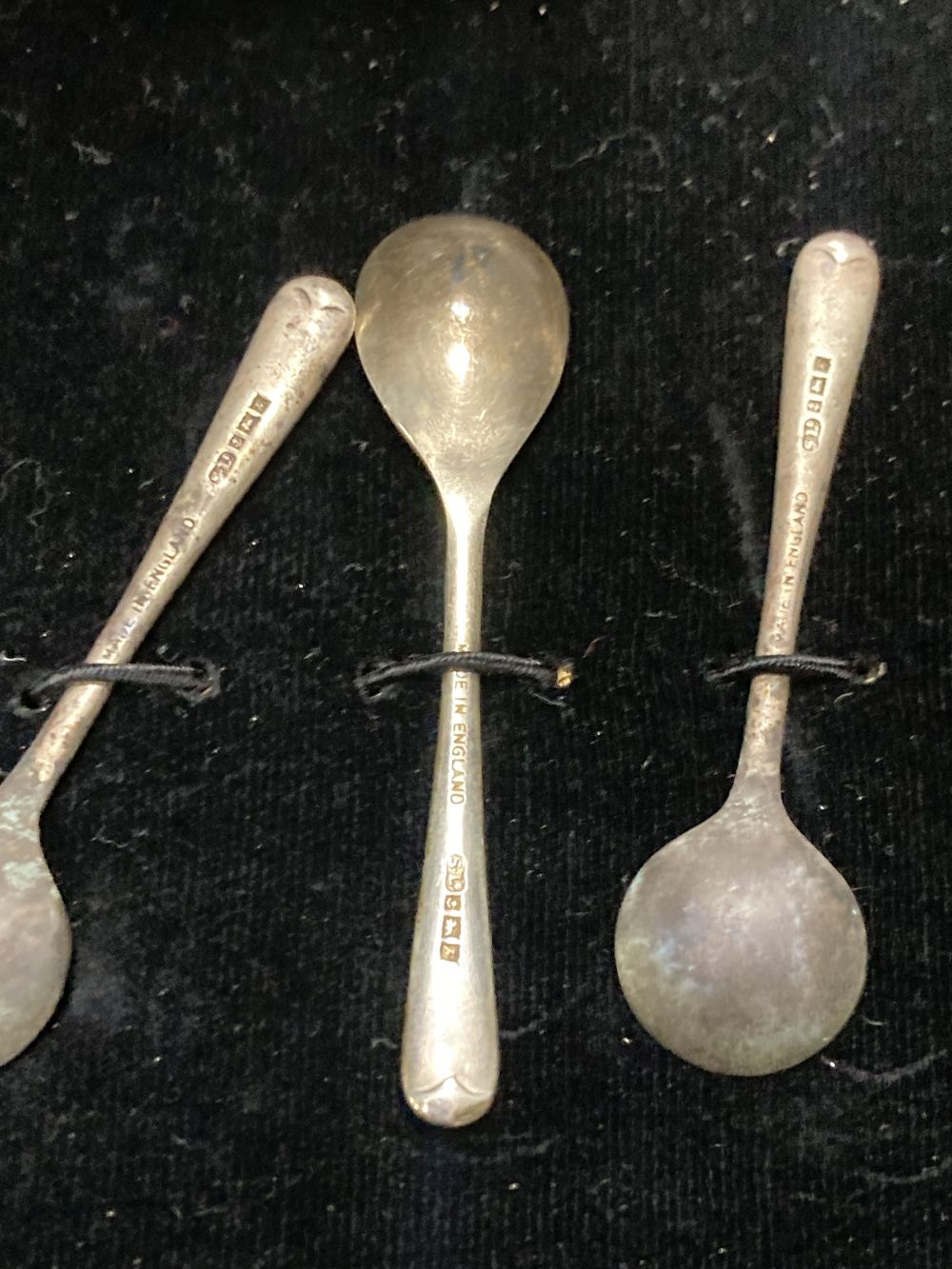 A late 1950s cased silver five piece condiment set, with three spoons, Birmingham, 1957.